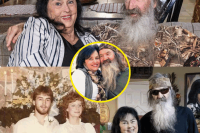 PHIL ROBERTSON’S DYING GRIP ON KAY’S HAND EXPOSES GUT-WRENCHING SECRET: DUCK DYNASTY LEGEND’S FINAL MOMENTS UNCOVER A BRUTAL BETRAYAL—WHAT DID SHE REALLY HIDE?  Get ready for a Duck Dynasty bombshell that’s sending shockwaves through America! On May 29, 2025, the world was left in tears as Kay Robertson held her husband Phil’s hand during his final moments. Their 60-year marriage, built on love and redemption, has been celebrated by fans everywhere—but a new revelation is threatening to shatter the idyllic image.  Phil Robertson, who passed at 79 after a secret battle with Alzheimer’s, squeezed Kay’s hand every night, a symbol of devotion that fans saw as the ultimate love story. But now, a chilling twist has emerged: just days after their final photo together on May 27, 2025, insiders have leaked explosive details—Kay allegedly hid a $2 million family feud over Phil’s estate. Fragments of a will suggest she cut out one of their sons, claiming it was to “protect the family legacy.”  Fans are devastated, torn between mourning their love story and questioning the darker truth behind the Robertson legacy. Was Kay’s emotional farewell simply a loving act, or is it masking a ruthless power grab? What explosive secrets did Phil take to his grave, and why is the Robertson family fracturing at its core?