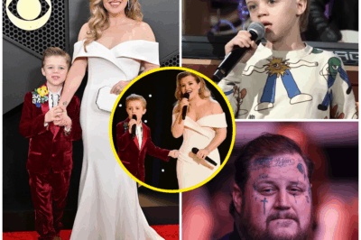“’I WOULD GIVE ANYTHING TO SING LIKE THAT WITH MY SON ONE DAY’ — JELLY ROLL’S EMOTIONAL REACTION TO KELLY CLARKSON AND SON REMY’S UNFORGETTABLE DUET!”  “I would give anything to sing like that with my son one day.” Jelly Roll’s voice quivered with emotion as he watched Kelly Clarkson and her 8-year-old son, Remy, perform a surprise duet that left the entire room breathless.  As Remy’s pure, innocent voice blended effortlessly with his mother’s powerhouse vocals, the raw sincerity of the moment overwhelmed the audience. But it wasn’t just their performance that stole the show—Jelly Roll’s reaction was what truly captured everyone’s hearts.  Tears in his eyes, Jelly Roll wiped his face and shared an honest confession that left the crowd in silence: “It was a moment I’ve dreamed of but never had.”  The audience erupted into applause, recognizing that they had witnessed something far beyond the music—it was the pure, undeniable bond between parent and child, a love so deep it transcended any performance.
