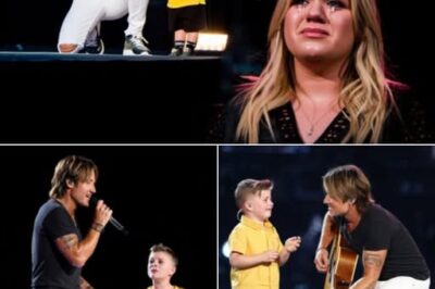 ““Remy, You’re Up!” – Keith Urban Hands the Mic to Kelly Clarkson’s 8‑Year‑Old, and the Entire Arena Turns to Mush Nashville was already buzzing, but jaws hit the floor when Keith Urban suddenly invited Kelly Clarkson’s son, Remy, onstage for an impromptu duet of “Because of You.” The little guy’s fearless vocals and megawatt grin melted every heart in the house, while Kelly wiped tears backstage, beaming like the proudest mom alive. One tender tribute, a roaring crowd, and a superstar kid moment the internet won’t stop replaying anytime soon.”👇👇