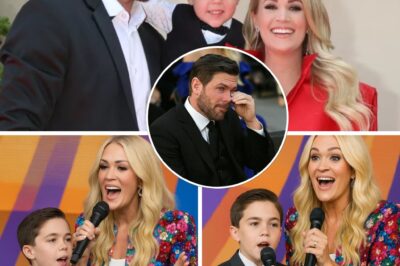“I’m Proud of You, Buddy” — Mike Fisher breaks down as his son joins Carrie Underwood in a Father’s Day tribute that brings the crowd to a halt. It started with small, shaky steps — then a gentle note from Carrie Underwood’s piano set the scene for something unforgettable. As her little boy sang his first solo, the crowd leaned forward, holding their breath, while Mike sat in the front row, blinking back tears. And when Carrie stepped back, letting her son sing the final note alone — “Dad is my hero” — Mike’s tears welled up, and the crowd stood. A new voice was born. A father’s heart melted. And a family’s love echoed louder than any applause.