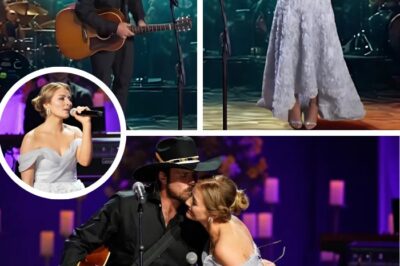 🎤🎤 Lukas Nelson gently began a song his father Willie once recorded with Loretta Lynn, as Emmy Russell, Loretta’s granddaughter, stood beside him in a soft lavender gown. With Loretta’s recent passing, the moment was full of emotion. Emmy’s voice shook with feeling, tears streaming down her face, while Lukas’ voice echoed his father’s. When they sang together, it was a moving tribute that felt like a torch being passed to a new generation. Watch their duet below. 👇
