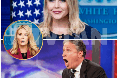 Karoline Leavitt’s Missing Cross Necklace Sparks Debate—Is It a Statement After Jon Stewart’s Remarks? Intense Plot: Leavitt’s absence of her iconic cross has ignited controversy, with fans and critics alike weighing in. What’s behind the change in her appearance and public image? Discover the truth now! 👇👇