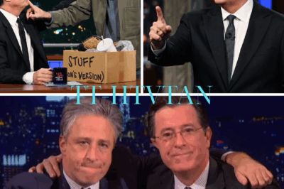Late-Night TV in Chaos: Jon Stewart Vows ‘I Won’t Be Silenced’  A whispered deal in a boardroom. A merger worth billions. A sudden axe falling on a late-night titan. Jon Stewart didn’t raise his voice. He didn’t need to. On Monday’s The Daily Show, he stared into the camera and let the truth do the talking: “I’m not going to be silent. This is bigger than you think.”  The crowd didn’t cheer. They leaned forward. What began as rumors about The Daily Show’s future spiraled into something heavier after CBS blindsided the industry by canceling The Late Show With Stephen Colbert, its top-rated franchise, set to end in May 2026. Stewart, a longtime friend and collaborator of Colbert, didn’t mince words. He hinted at forces beyond “financial decisions”—a shadowy alignment tied to Paramount Global’s $8 billion merger with Skydance Media, now under the scrutiny of a Trump-led FCC.  “We’re not just losing shows,” Stewart said, pausing as if weighing the cost of his next words. “We’re losing the right to speak.”  The studio went quiet. Phones started buzzing at Paramount. Because if Stewart’s right, this isn’t about budgets. It’s about control.  So what’s really happening behind the scenes? And why are network executives sweating as a comedian refuses to back down?