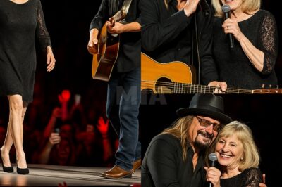 Kid Rock leaned back from the microphone, his trademark grin stretching wide across his face. “Well, look who just hijacked my show!” he laughed, his voice booming over the roar of the crowd.