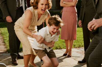 ch2-My sister dragged my son by his hair across the yard, screaming, “Your brat ruined my dress!” Mom laughed and said, “He deserved it. He needs to learn his place.” Dad joined in, chuckling, “He should apologize for existing.” I said nothing—just helped my son up, wiped his tears, and took him home. The next morning, police cars lined their driveway. Turns out, that “brat” owned the house they were living in—through the trust his late grandfather left in *my* name.